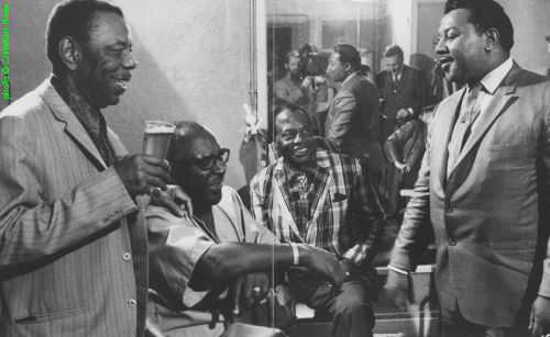 1970 AFBF ensemble (part of it, l to r) Champion Jack Dupree, Sonny Terry, 'Bukka' White, Clifton James at the American Folk Blues Festival in Paris, France, November 9, 1970. In the background [actually: in the mirror!]: Kurt Mohr; source: Philippe Bas-Rabérin (ed.): Blues - Les Incontournables.- Paris (Éditions Filipacchi) 1994, pp. 126/127; photographer: Christian Rose; click to enlarge!