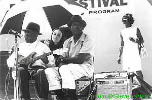 Nathan Beauregard with helper, nephew Marvin Reeves and Verlina (Mrs. Johnny) Woods at the Memphis Country Blues Festival, June 1969; source: Postcard taken from The Blues - A Book of Postcards (Pomegranate Artbooks) 1989 Stephen C. LaVere - Revised 1993; photographer: Steve LaVere; click to enlarge!