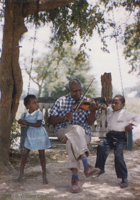B U T C H   C A G E entertaining neighborhood children with his violin in Zachary, Louisiana, summer 1960; source; Front cover of Storyville SLP 129; click to enlarge!