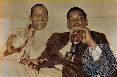 Unknown [not J.T. Brown, as claimed by some!] & <b>Elmore James; source: http://www.olemiss.edu/depts/general_library/archives/blues/; photographer's name not given; [this photo has been in the possession of Oliver Davis who owned the Delta Fish Market<br>in Chicago, given to him by the 'Unknown' on the left]; photo has been photoshop embellished by Stefan Wirz