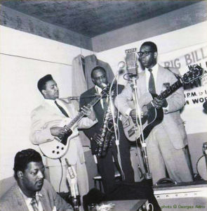 Big Bill Hill (disc jockey), Homesick James, g; J.T. Brown, ts; Elmore James, voc, g; Cassell Burrow, dr at Thelma's Lounge, Chicago, 1959; photographer: Georges Adins; click to enlarge!