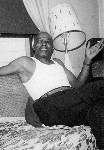 B U D D Y   M O S S relaxes at home during the early 1960s; source: Lawrence Cohn: Nothing But The Blues, p. 227; photographer: Bruce Bastin; click to enlarge!