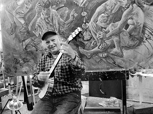 Art Rosenbaum plays six string banjo<br>in front of one of his paintings, 2005; photographer: Fred C. Fussell; click to enlarge!