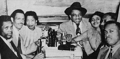 Walter Horton, Willie Nix and wife Pattie, J.T. Brown and wife Katie, Muddy Waters, and Jimmy Rogers at a gathering in Chicago of former Mississippi musicians, Chicago, c. early 1953; source: Mississippi Blues Trail marker #144, dedicated November 4, 2011 ('courtesy Patty Nix/Delta Haze Corp.'); a bit photoshop treated by Stefan Wirz