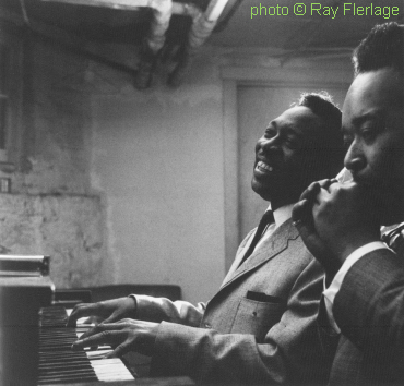 O T I S   S P A N N  with James Cotton, hca, in Muddy Waters' basement flat/studio at 4339 South Lake Park in Chicago, Illinois, 1965; source: Lisa Day (ed.): Chicago Blues as seen from the inside - The Photographs of Raeburn Flerlage.- Chicago (ECW Press) 2000, p. 15; photographer: Ray Flerlage