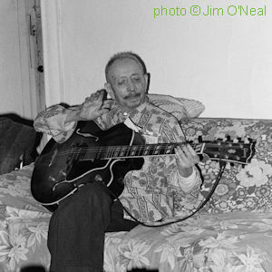 T a m p a   R E D 7, 1974; 'Tampa with the last guitar he had, in 1974. It looks like he's playing it but he was just holding it, wishing he could.' source: ; photographer: Jim O'Neal