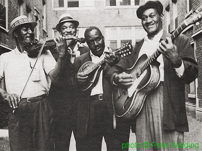The Chicago String Band: Carl Martin, John Wrencher, Johnny Young, John Lee Granderson; source: front cover of Testament T-2220; photographer: Pete Welding; click to enlarge!