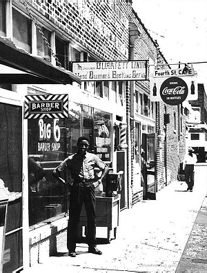 Wade Walton outside his 'Big 6 Barber Shop', 1960 at 4th Street (now Martin Luther King Blvd), Clarksdale, MS 38614, 1960; source: Paul Oliver: Conversation with the blues.- Cambridge Univ. Press, 1997, p. viii; photographer: Paul Oliver